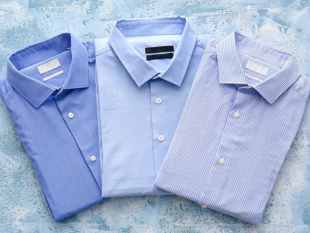 três camisas masculina em tons de azul